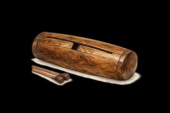 Traditional wooden slit drum and beaters, used to announce festivities